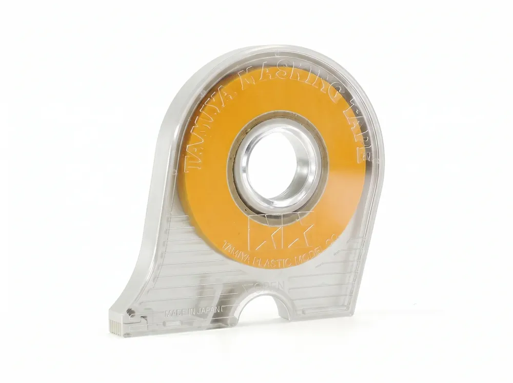 Role maskovací pásky Tamiya 87031 Masking Tape 10 mm v plastovém odvíječi s řezačem